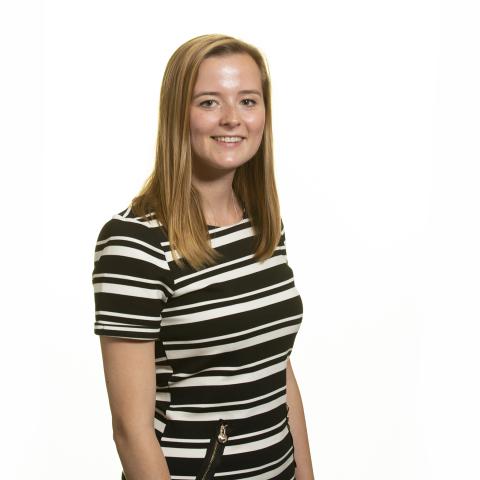 Young professional woman in stripey top